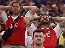 Arsenal fans in despair and players in tears as they lose Champions League final on penalties after their star centre back blazed his kick over the crossbar