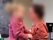 Emotional moment reporter fights back tears as Aussie mother plays clip of her toddler being returned to her allegedly abusive father under controversial international law