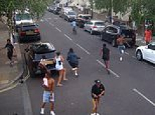 Moment terrified witnesses flee after man, 20, stabbed to death in daylight attack on London street - as two men arrested
