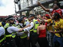 Nine people are arrested at Premier League title parade in north London as chaos erupts following Champions League defeat