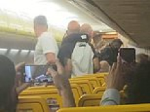 Drunk and abusive air passengers would be banned from flying under national 'blacklist' proposals being drawn up by ministers amid soaring 'air rage' attacks on plane crews and holidaymakers