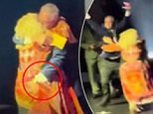 Crowd gasps as 2HD radio boss Guy Ashford 'GROPES' presenter Cheralyn Darcey on stage as she accepts an award