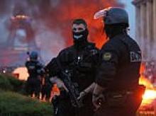 A tale of two teams: France in flames and nearly 800 arrested as PSG win Champions League final... while Arsenal fans enjoy Premier League parade in London
