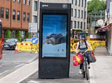 Cyclists are forced to take evasive action after new London bike lane was built around BT advertising board