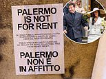 Police arrive at Dua Lipa's wedding venue as locals in Palermo erect posters declaring 'the city is not for rent' amid claims Sicily has been 'shut down for singer's three-day wedding extravaganza'