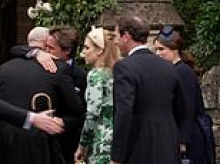 Beatrice and Eugenie welcomed back in the fold by Mike Tindall: Ex-rugby ace led the way in greeting the York sisters and wrapped Edo in a bear hug