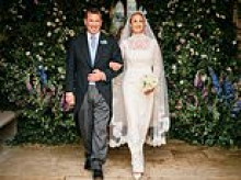 Newlywed bliss! Peter Phillips and wife Harriet Sperling beam in official wedding portraits