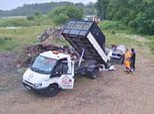 Moment brazen flytippers dump van-load of rubbish including armchair, dining chair and oven on private land
