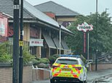 Body of man, 55, is found inside empty TGI Friday's restaurant as police launch murder probe: Two women aged 35 and 54 are arrested