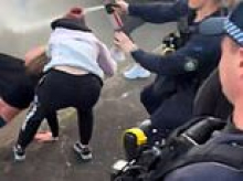 Wild scenes as $5,000 cash giveaway spirals into chaos on the street as police are forced to use pepper spray on crowd: 'Fear and concern'