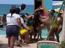 Shocking moment bikini-clad women's poolside dispute descends into full-blown fighting match at exclusive Bahamas beach club