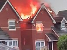 Moment massive flames ravage family home after being struck by lightning during thunderstorm