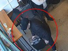 Moment Algerian asylum seeker steals packed suitcase worth £4,100 from coffee shop after he'd been freed from jail following luxury watch robbery