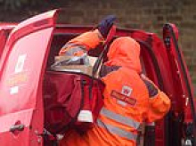 Royal Mail profits more than halve as it is rocked by Labour's jobs tax and slump in letter volumes