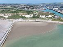 Furious locals storm UK beach shut by French owners as Britain swelters in heatwave