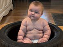 'Huge' adorable eight-month-old baby has already outgrown clothes made for five-year-olds... as his mother admits carrying him is a 'two-person job'