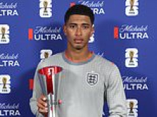 Rude Jude's mood! Bellingham scowls and says 'I don't deserve this' at Man of the Match ceremony - after lip-reader revealed his foul-mouthed row in Ghana World Cup flop