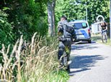 Mother who claimed her baby was snatched from its pram outside her house is now suspected by cops of dumping the dead boy in nearby stream herself