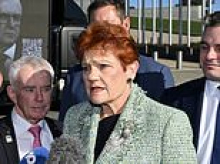 Pauline Hanson clashes with ABC reporter over her monoculture vision - as 'Fire the Liar' trucks circle Parliament House