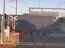 Video captures moment of carnage as train slams into truck caught on the tracks - as investigation finds driver failed to alert authorities   of the hazard