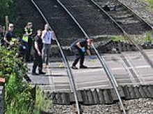 Person dies and child fighting for life after train hits car at level crossing