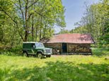 Tiny one-bed wooden shack hits the market for £850,000 - but you get land the size of 53 football pitches thrown in for the price