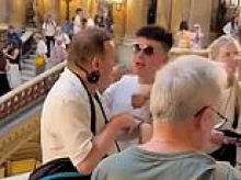 Moment irate Western tourist reprimands deaf Chinese holidaymakers for hogging prime selfie spot at Parisian palace - before fight breaks out