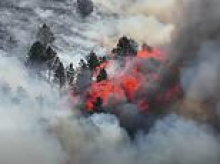 Wildfire burns in Peak District as Britain records hottest June day again and red weather warning is extended