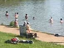 Security guards in Hampstead Health are threatened by irate swimmers trespassing in bird pond during heatwave - as barbed wire fencing is put up to keep them out