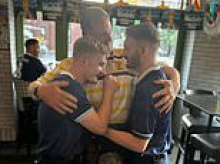 Heartwarming moment two Scotland fans at the World Cup are surprised by their father in the US - as 'Tartan Army' are hailed despite early exit fears