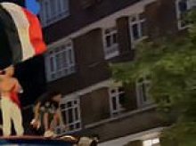 Egyptian fans bring chaos to London as they battle with police and climb on double decker bus to celebrate team's World Cup win