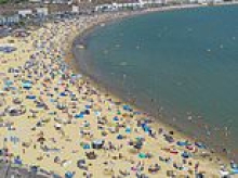 You wait ages for a heatwave, then three turn up at once! UK set to sizzle for THIRD time this summer, with temperatures expected to top out at 34C next week