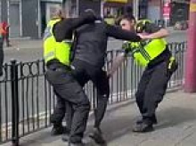 Moment police officer is hit with his own baton in chaotic stop and search - before suspect flees on e-bike