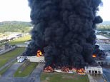 Massive fire breaks out at warehouse sending unbelievably thick clouds of black smoke billowing into the sky