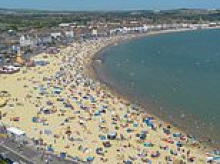 Brits are bracing for another heatwave as Met Office warns of 35C temperatures - as forecasters issue yellow weather warning for RAIN