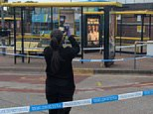 Hero 'wrestles knifeman to the ground and kicks weapon away' after brawl broke out at Merseyside bus station: Two rushed to hospital