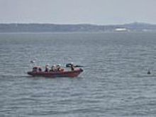 Person is rushed to hospital after jet ski and inflatable carrying children collide off the coast of Hampshire