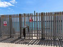 French fight back in battle over British beach: Foreign firm welds gate shut and installs new locks after Sussex locals broke through to get onto the sand for first time in 18 years