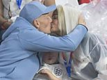 Megan Pickford says 'sorry' to son Arlo, 7, for being stuck in the middle of her passionate kiss with England star goalie Jordan to celebrate his 'magic' World Cup performance