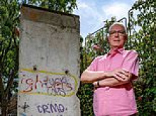 Homeowner who erected section of Berlin Wall in his garden without planning permission is ordered to tear it down after council warned it created an 'oppressive sense of enclosure'