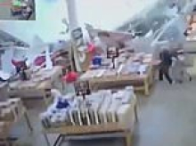 Terrifying moment roof COLLAPSES on shoppers at busy store sparking panic and sending shelves flying