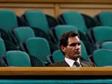 The lonely last man in the Royal Box: Roger Federer is hailed for staying late until last ball at Wimbledon at 11pm - while rest of A-listers went for dinner!