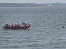 Man in his fifties dies after being hit by a jet-ski whilst riding on an inflatable with children off Hampshire coast
