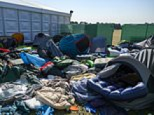 The Wimbledon queue tent mountain: Discarded sleeping bags and camping gear left by fans piles up in park next to All England Club