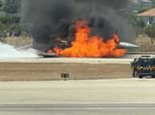 Fighter jet crash lands at Greek holiday island airport after mysteriously bursting into flames in mid-air