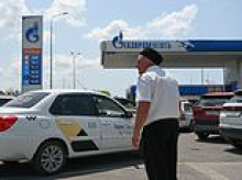 Guards are brought in to keep order as huge queues form at Russian petrol stations following wave of successful Ukrainian attacks on refineries