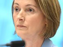 Telstra boss returns from overseas as outrage explodes over outage - and fears grow a woman may have died after Triple Zero chaos