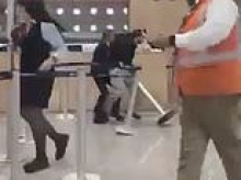 Drunk passengers filmed trashing airport after being thrown off plane for rowdy behavior