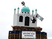 Loyalists torch 'sickening and cowardly' Northern Ireland bonfire with replica mosque on top before police can move it to take it down