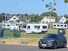 Travellers take over school playing fields with more than a dozen caravans and threaten staff - forcing them to cancel sports day and PE classes